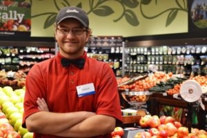 Josh pictured in the produce department of a grocery store