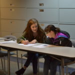 MU student sits with a participant from Inspiring Success