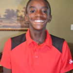 Fadraon smiling wearing a red shirt