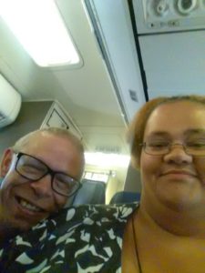 Jason and Katie take a selfie on the airplane