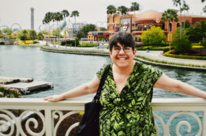 Mary poses at Universal Studios after having lunch at Hard Rock Cafe.