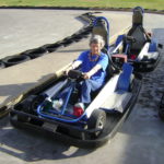 woman sits in go-kart