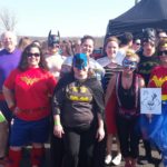 Group of people in costumes getting ready for Polar Plunge event.