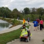 people walking around stephens lake