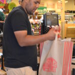 Isaac bags groceries at Lucky’s.