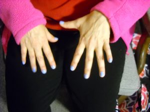 Photo of painted fingernails.