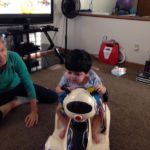 Mustafa rides on a battery powered car