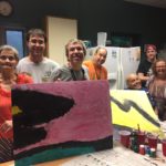 Group of people posing with art created.