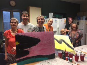 Group of people posing with art created.