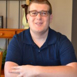 photo of nicolas sitting at a table