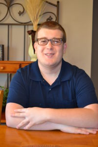 photo of nicolas sitting at a table