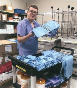 photo of nicolas folding linen bags for the supply closet