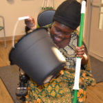 Individual receives cleaning supplies.