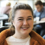 Ellie smiles for the camera in MU Student union
