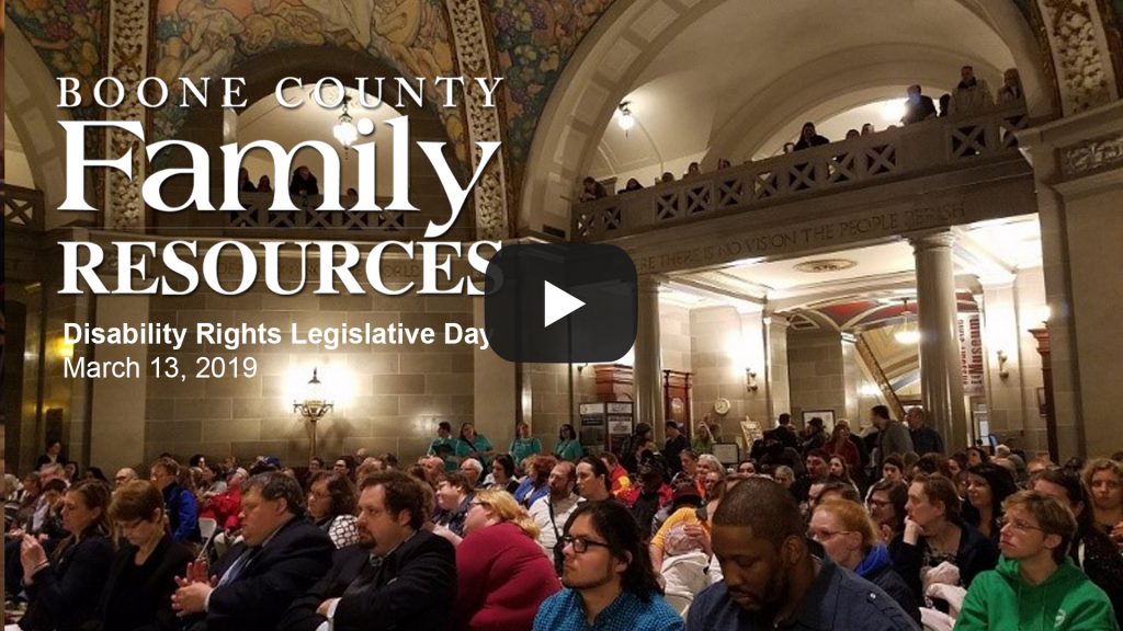 A large gathering of people seated in the Missouri State capital rotunda.
