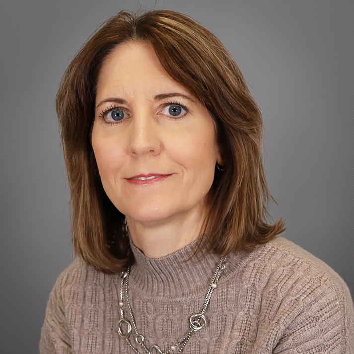 Stacey is a light skin woman with shoulder length brown hair.