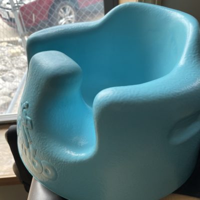 Light green positioning seat for toddler Bumbo