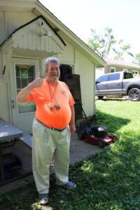 Steve giving a thumbs up after the renovations in the back of his house.